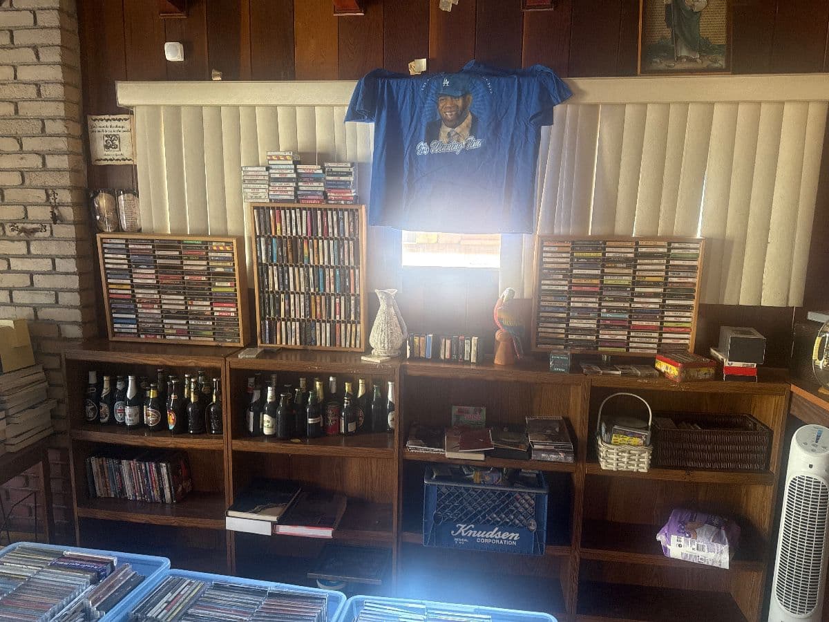 Jewelry CDs tapes, DVDs, VHS galore, lots of clothing, vintage photo 1